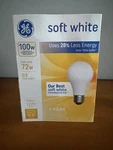 4 New In Box - Ge Light Bulbs, 100W, Soft White Pack Uses 28% Less Energy. Price: $42.49.
